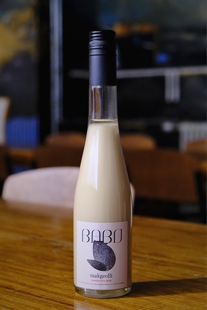 Full bottle of Babo Makgeolli, artisanal Korean rice wine brewed in Belgium.